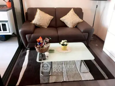 Cozy living room with modern sofa and stylish coffee table in a chic apartment.