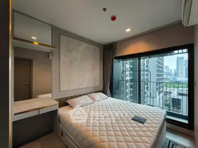 Modern bedroom with city view and large window in high-rise apartment