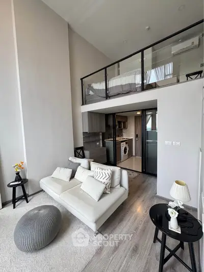 Modern loft apartment with stylish living room and mezzanine bedroom