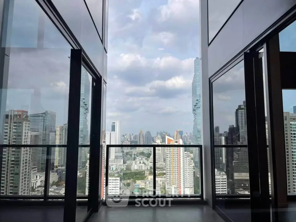 Stunning city view from a modern high-rise balcony, perfect for urban living.