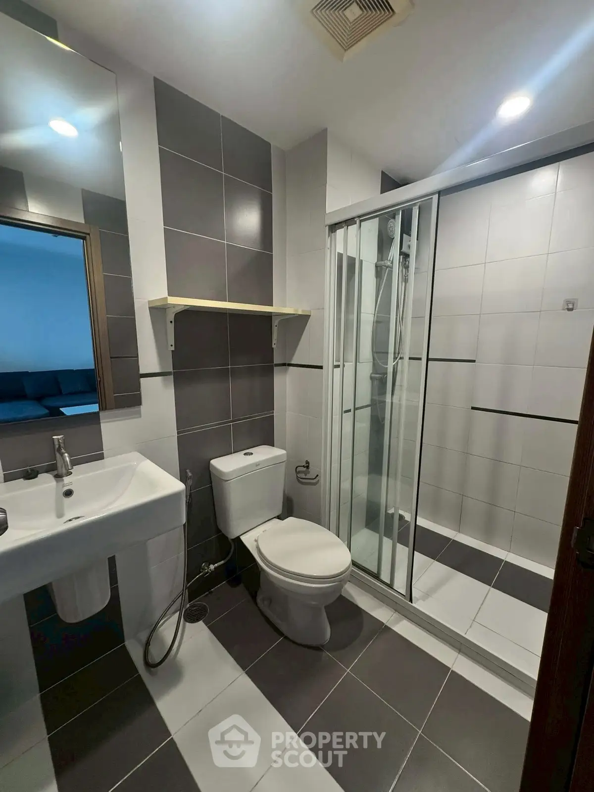 Modern bathroom with sleek shower enclosure and stylish tiles