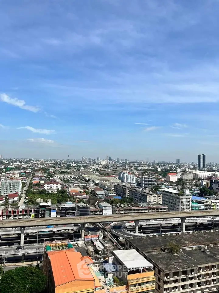 Stunning cityscape view from high-rise building showcasing urban skyline and transportation infrastructure.