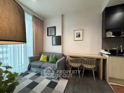 Modern living room with cozy sofa and stylish kitchen corner