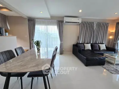 Modern living room with sleek furniture and natural light, perfect for stylish urban living.