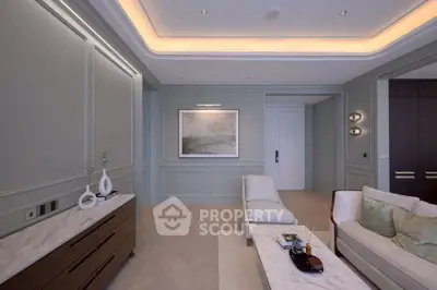 Elegant living room with modern decor and ambient lighting, featuring a stylish sofa and chic artwork.