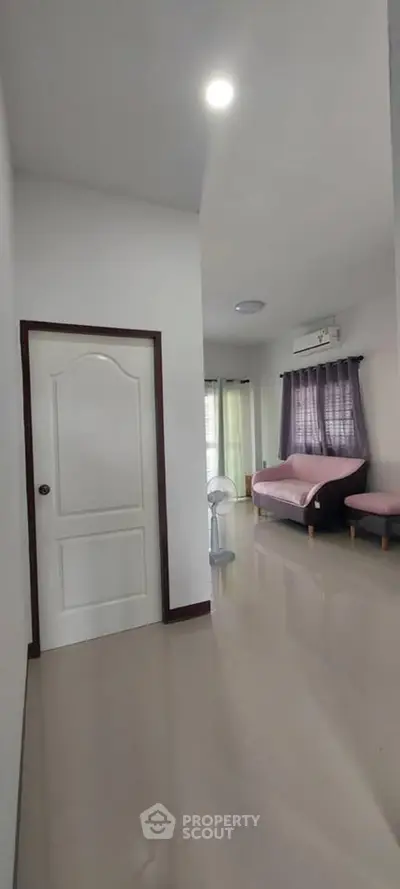 Spacious living room with modern decor and natural light