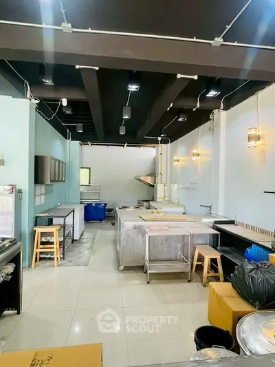 Spacious commercial kitchen with modern fixtures and ample workspace