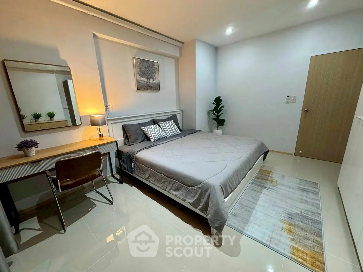 Modern bedroom with sleek design, cozy lighting, and stylish decor for a comfortable living experience.