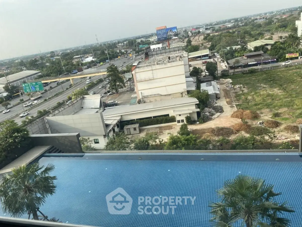 Stunning rooftop pool with panoramic city view, perfect for relaxation and leisure.