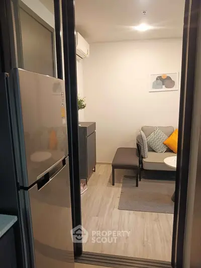 Cozy modern living room with stylish decor and compact layout, perfect for urban living.