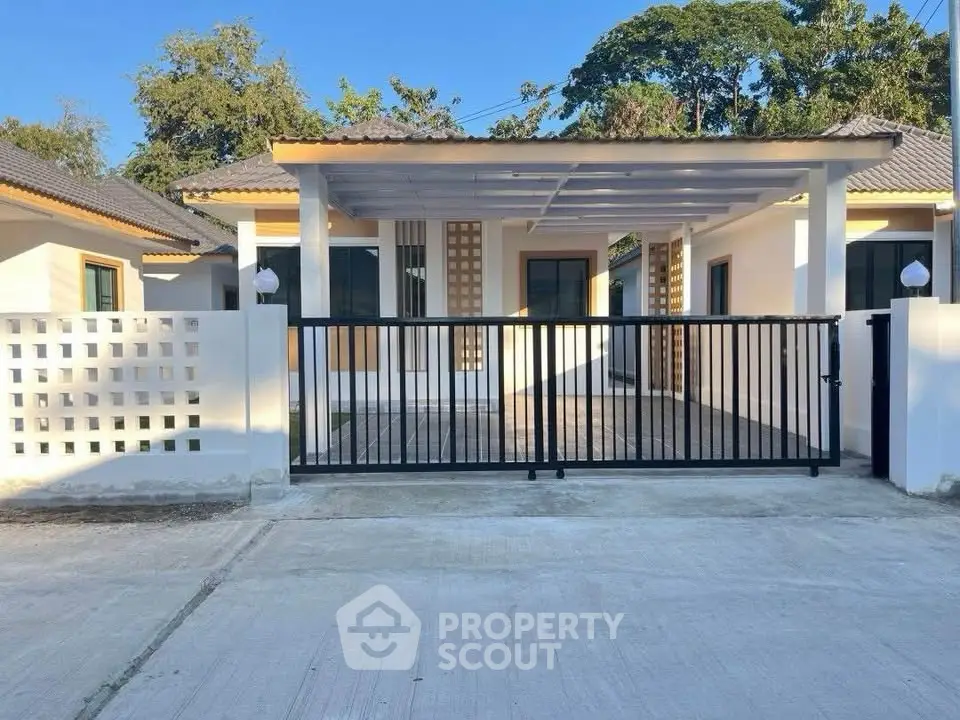 Charming single-story home with modern design and spacious driveway in a serene neighborhood.