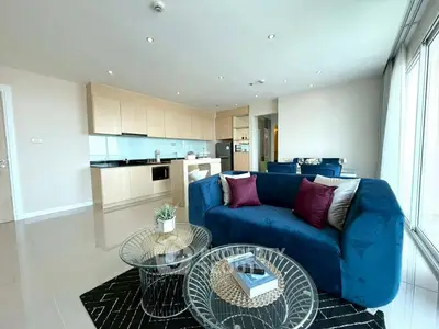 Spacious modern living room with open kitchen and elegant decor