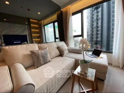 Modern living room with large windows and city view, featuring a cozy sofa and elegant decor.