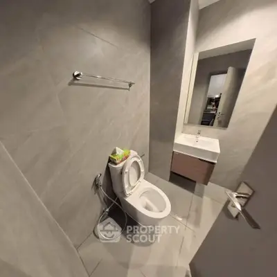 Modern bathroom with sleek gray tiles and contemporary fixtures