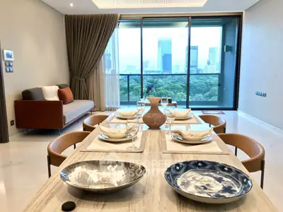 Luxurious dining area with stunning city view from high-rise apartment