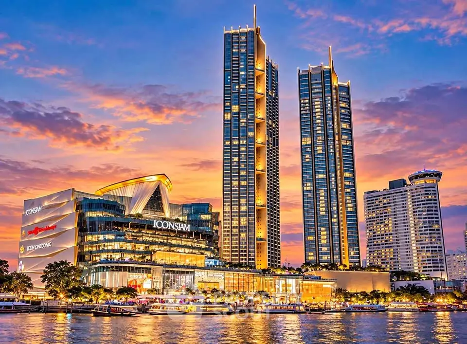 Stunning view of Iconsiam luxury riverside development at sunset with vibrant skyline.