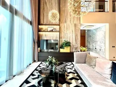 Luxurious modern living room with high ceilings and elegant decor