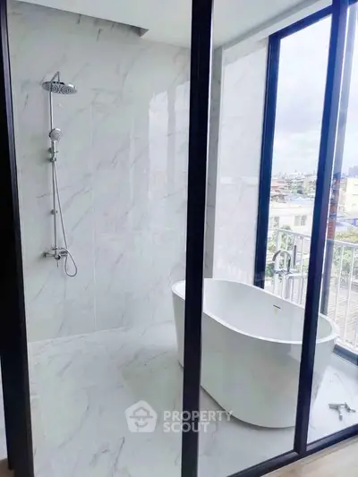 Luxurious bathroom with freestanding bathtub and city view, featuring elegant marble tiles and modern shower.
