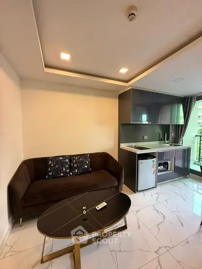 Modern living room with sleek kitchen and balcony view