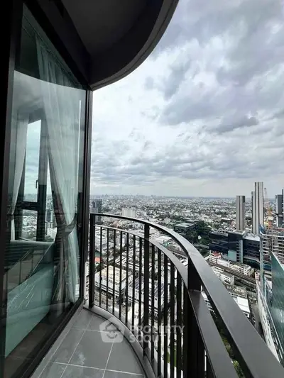 Stunning high-rise balcony with panoramic city views, perfect for urban living.