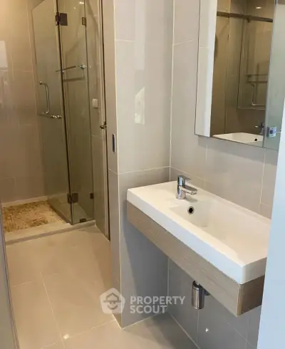 Modern bathroom with sleek design and glass shower enclosure