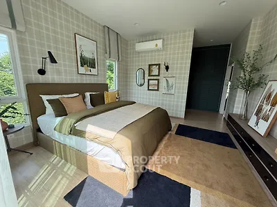 Stylish bedroom with modern decor and large window offering natural light and greenery view.