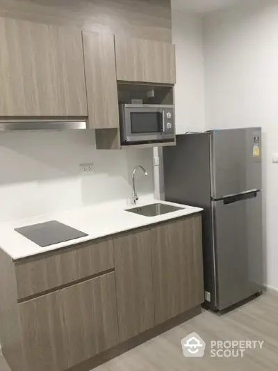 Modern kitchen with sleek cabinetry and stainless steel appliances