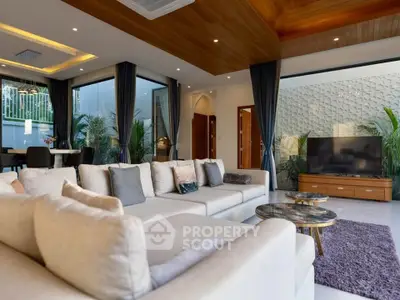 Luxurious modern living room with elegant decor and spacious seating area, perfect for relaxation and entertainment.