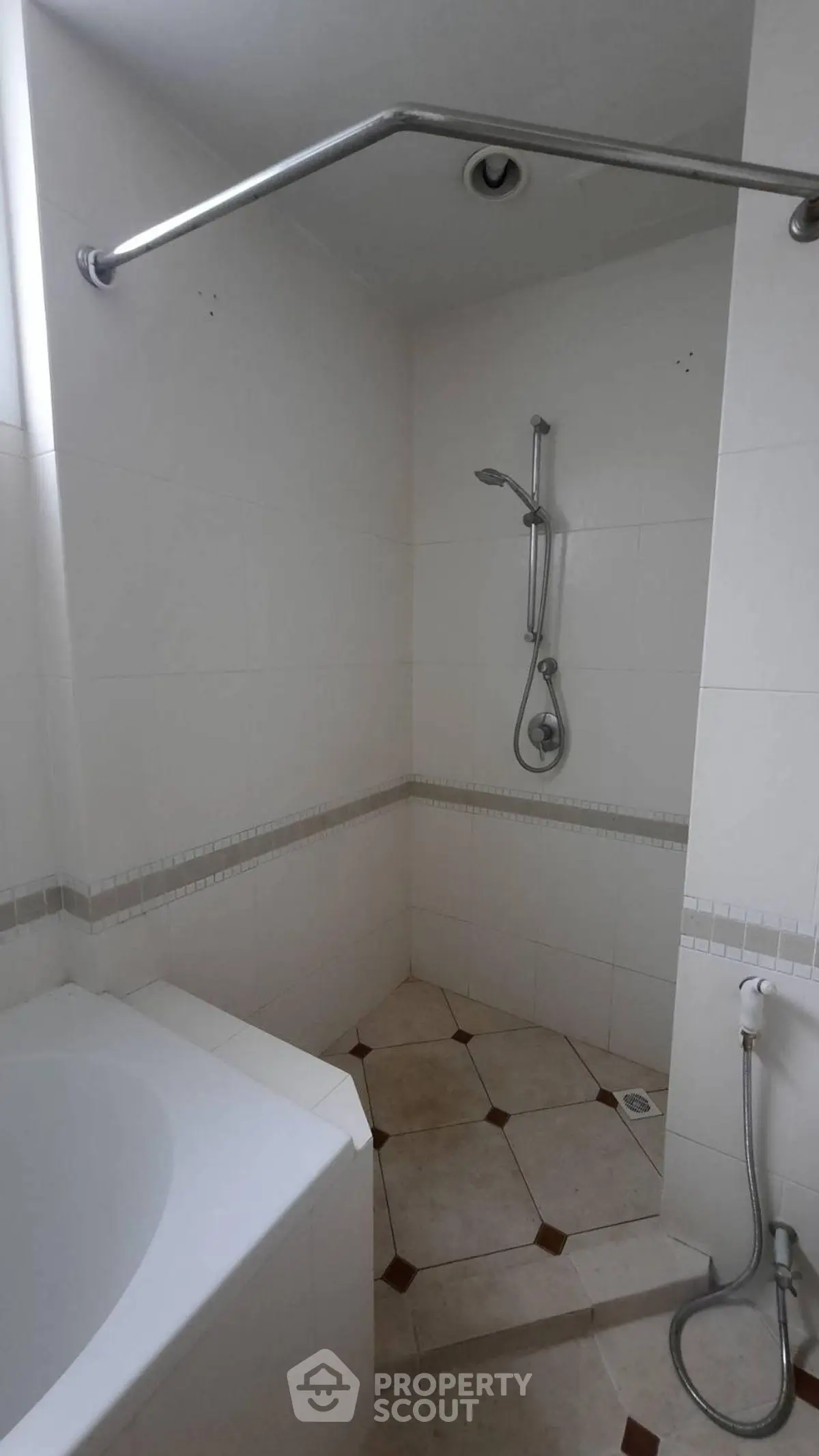 Spacious bathroom with modern shower and bathtub