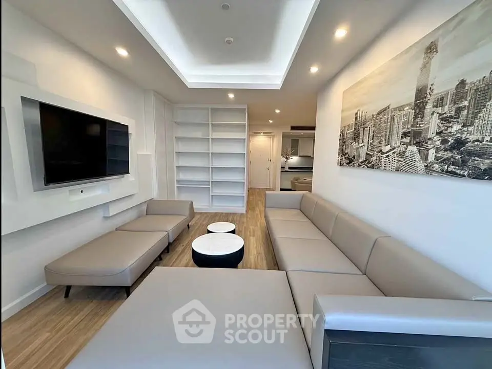 Modern living room with sleek furniture and built-in shelving, perfect for urban living.