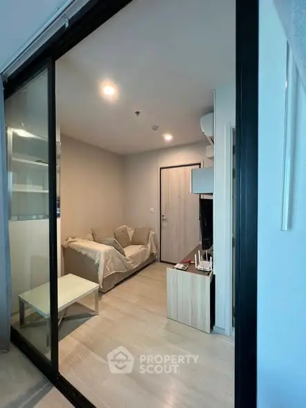 Modern living room with sliding glass doors and cozy furnishings