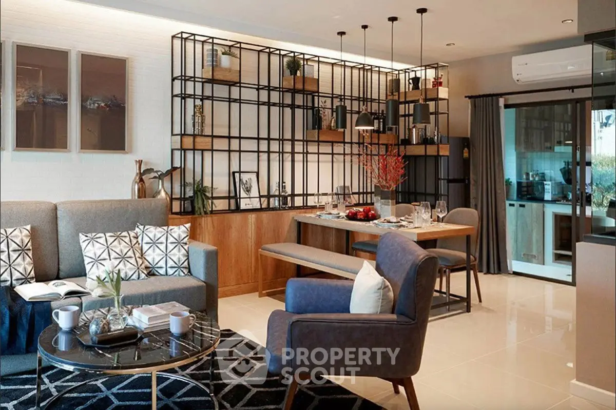 Modern open-plan living and dining area with stylish decor and natural light.
