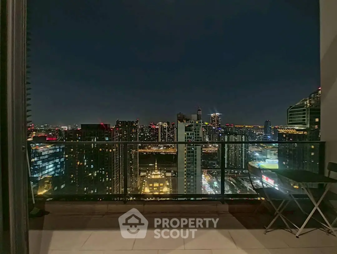 Stunning cityscape view from a modern balcony at night, perfect for urban living.