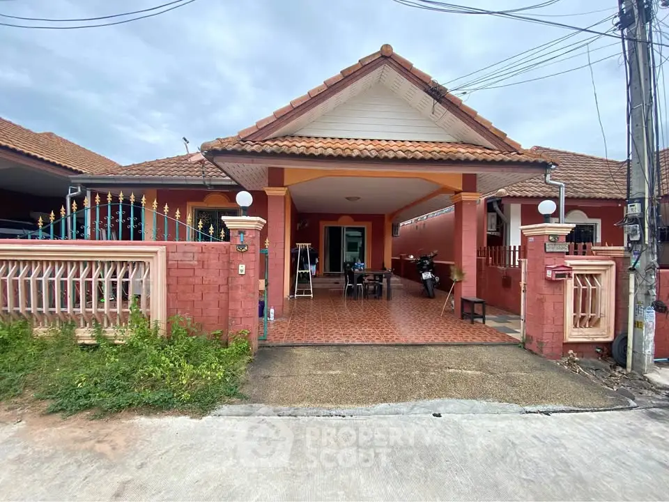 Charming single-story house with tiled roof and spacious front patio