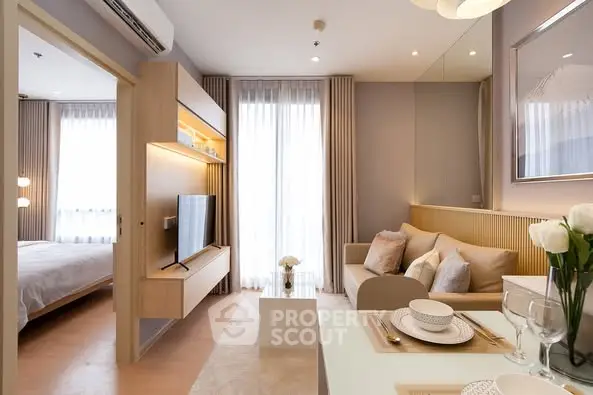 Modern open-plan living room with elegant decor and natural light
