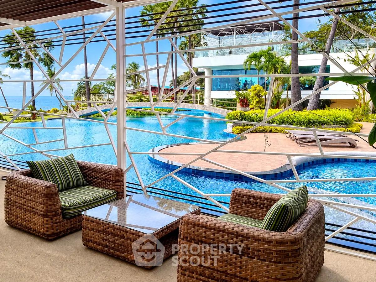 Luxurious poolside view with modern outdoor seating and lush landscaping.
