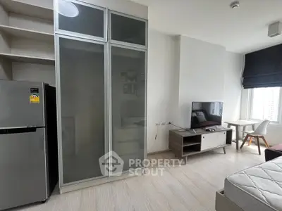 Modern studio apartment with sleek furniture and natural light