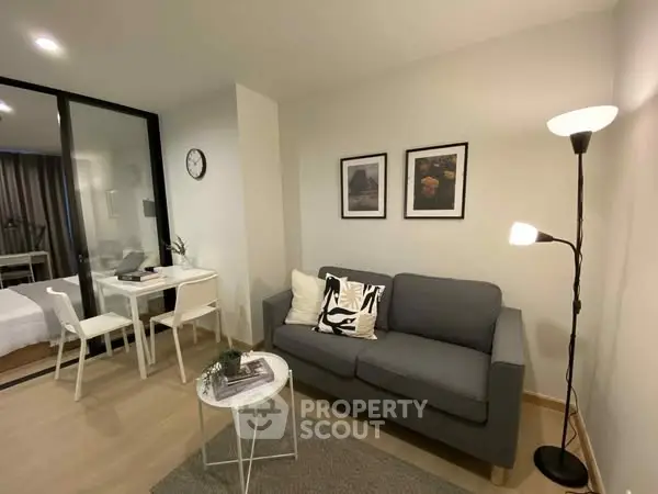 Modern living room with cozy gray sofa and stylish decor