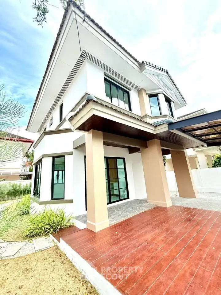 Stunning modern house with spacious outdoor patio and elegant architectural design.