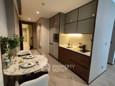 Modern kitchen with open layout and dining area in stylish apartment