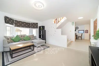 Spacious living room with modern decor and natural light