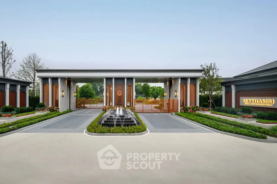Luxurious modern building entrance with elegant landscaping and fountain