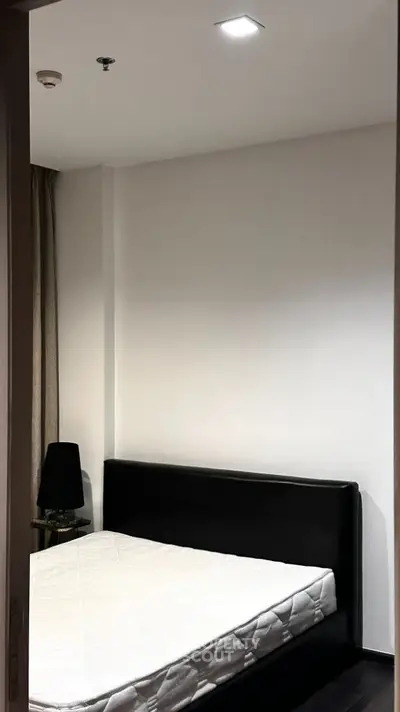 Cozy bedroom with modern minimalist design and comfortable bed