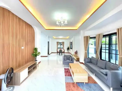 Spacious modern living room with elegant lighting and stylish furniture