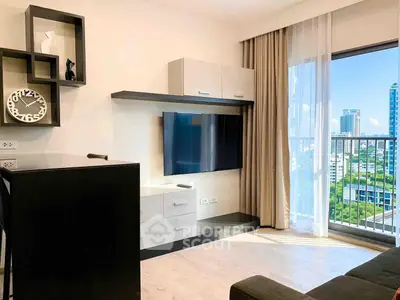 Modern living room with sleek TV unit and city view balcony in high-rise apartment.