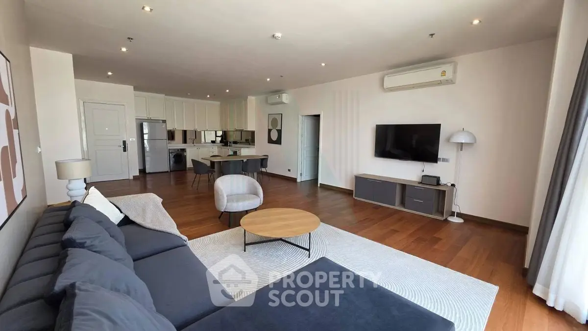 Spacious modern living room with open kitchen and stylish decor