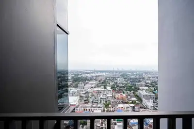Stunning high-rise city view from a modern balcony, perfect for urban living enthusiasts.