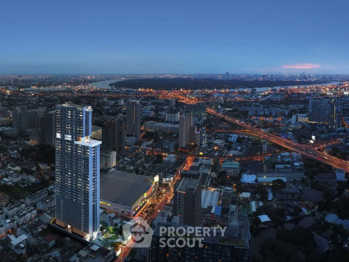 Stunning aerial view of modern high-rise building in vibrant cityscape at dusk.