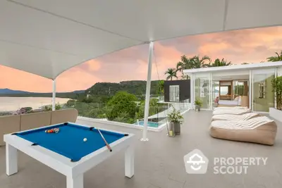 Luxurious rooftop terrace with pool table and stunning sunset view