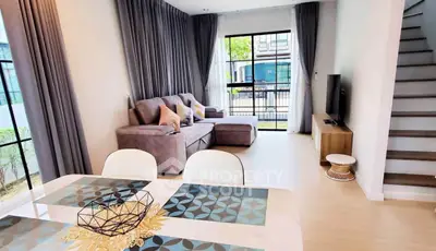 Modern living room with stylish decor and large windows for natural light